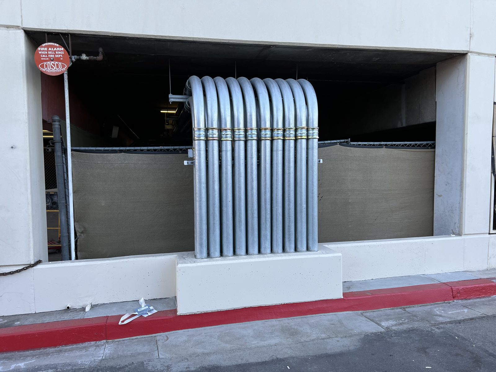 Rigid conduit stub-up bank on a concrete pad